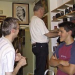 A volunteer and colleagues helping prepare a display