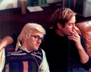 David Hockney rests his head on the shoulder of a young male friend