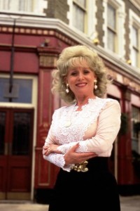 Promotional still for Eastenders with Barbara Windsor as Peggy Mitchell in front of the Queen Vic