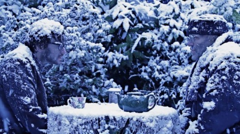 Welcome to the Majority scene - two men sat at a table in the snow