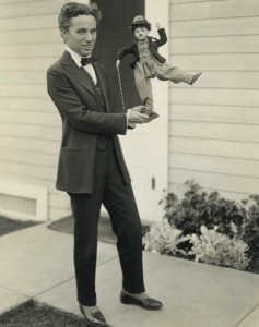 Charlie Chaplin with doll