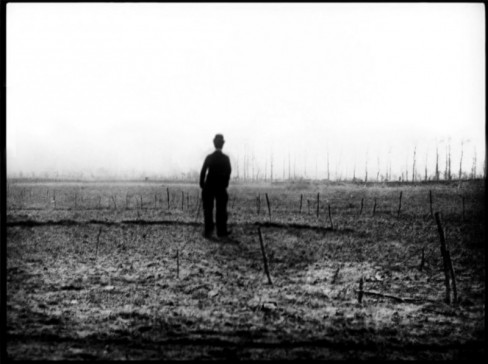 Silhouette of Charlie Chaplin in a barren field 