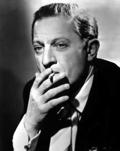 Portrait of Director Jules Dassin, smoking.